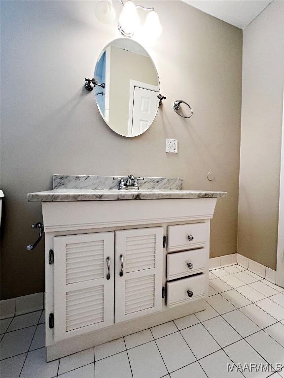 bathroom with tile patterned floors and vanity