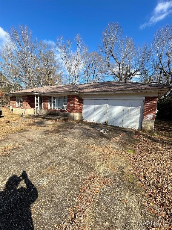 single story home with a garage