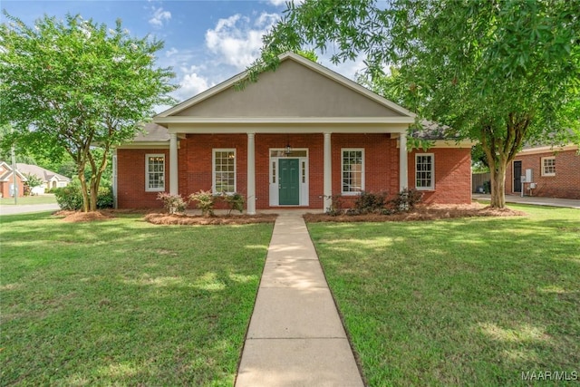 greek revival inspired property with a porch and a front lawn