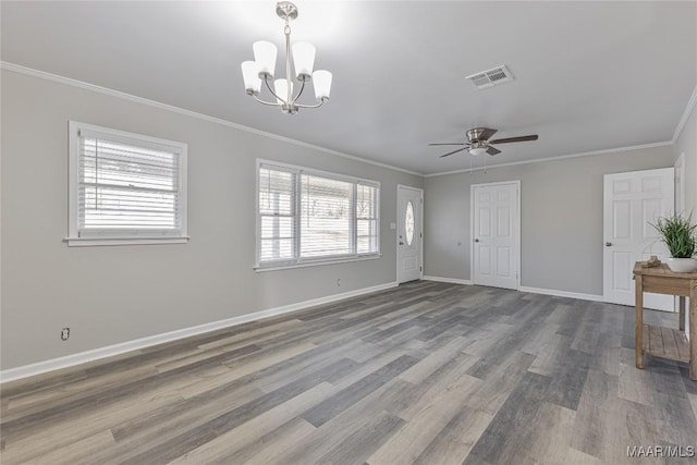 unfurnished living room featuring visible vents, ornamental molding, wood finished floors, baseboards, and ceiling fan with notable chandelier