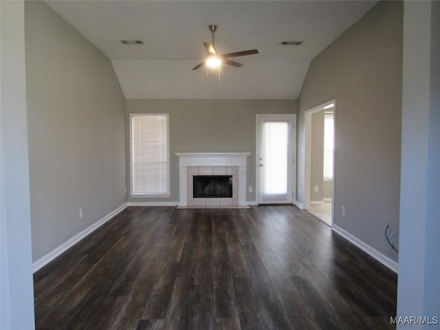 unfurnished living room with visible vents, baseboards, dark wood finished floors, and vaulted ceiling