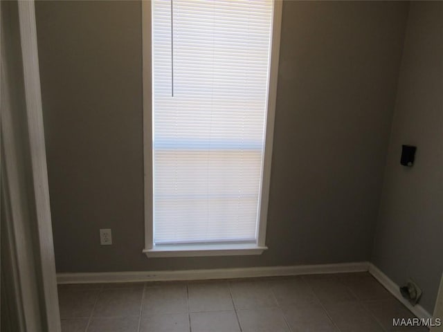 tiled spare room with baseboards