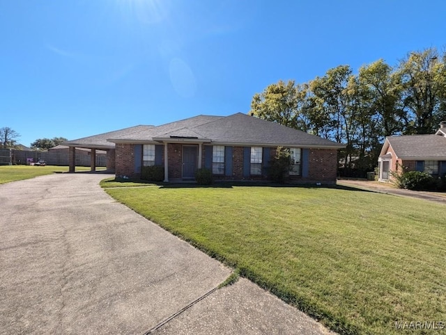 single story home with a front lawn and a carport