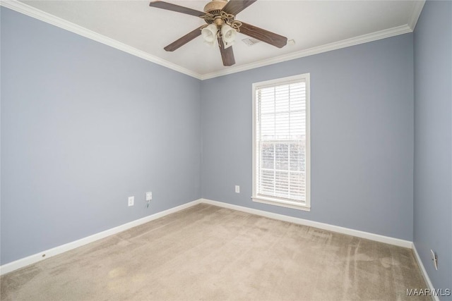 carpeted empty room with ceiling fan and crown molding