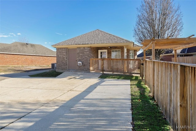 back of house featuring a pergola