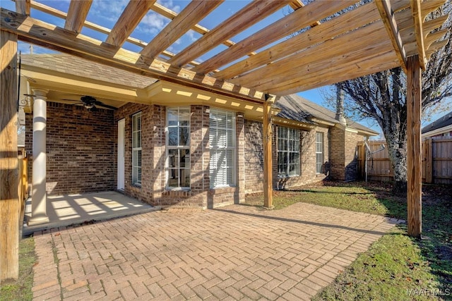 view of patio with ceiling fan and a pergola