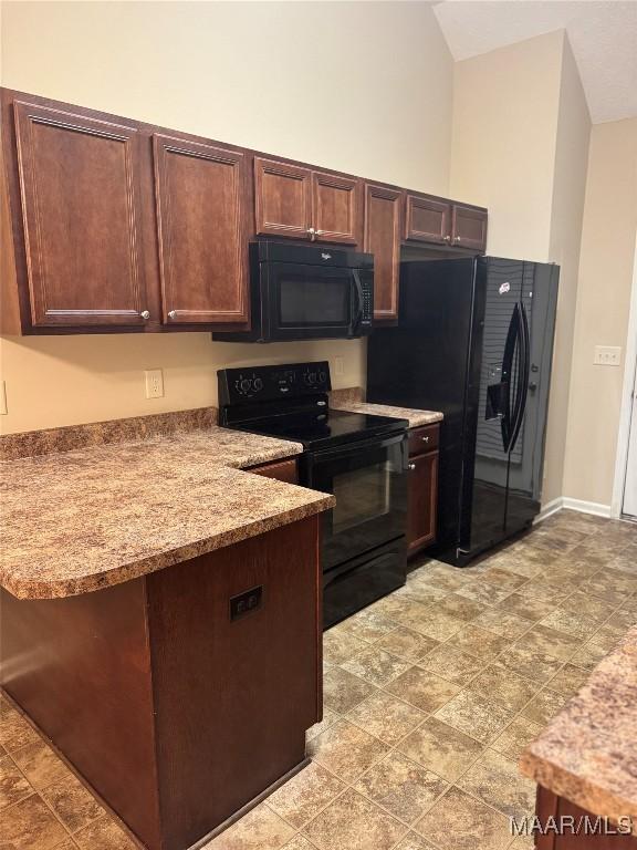 kitchen featuring black appliances, light stone countertops, and dark brown cabinets