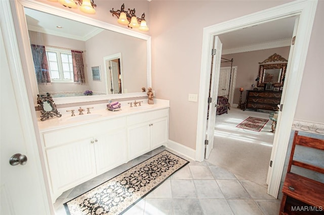 bathroom featuring vanity, tile patterned flooring, and crown molding