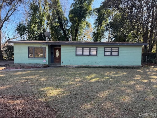 ranch-style house featuring a front lawn