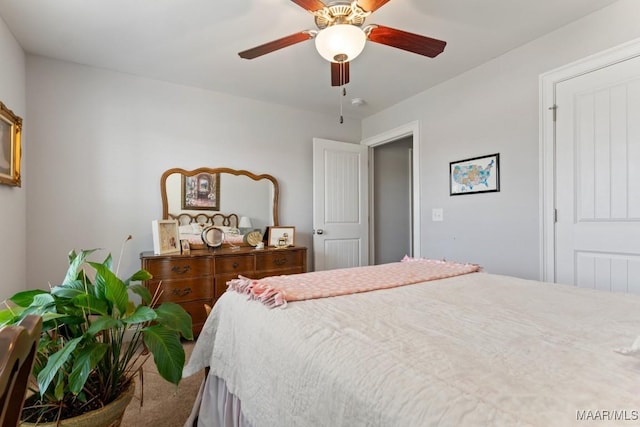 bedroom featuring ceiling fan and carpet floors