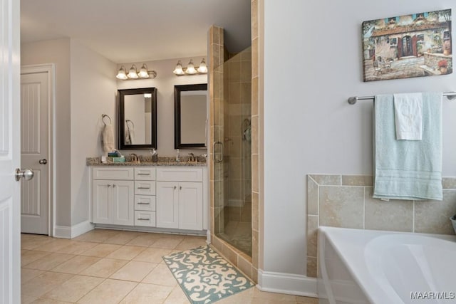 bathroom with vanity, tile patterned floors, and plus walk in shower