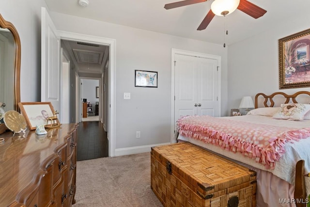 carpeted bedroom featuring ceiling fan and a closet