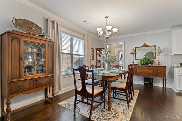 dining space featuring a notable chandelier, crown molding, and dark hardwood / wood-style floors