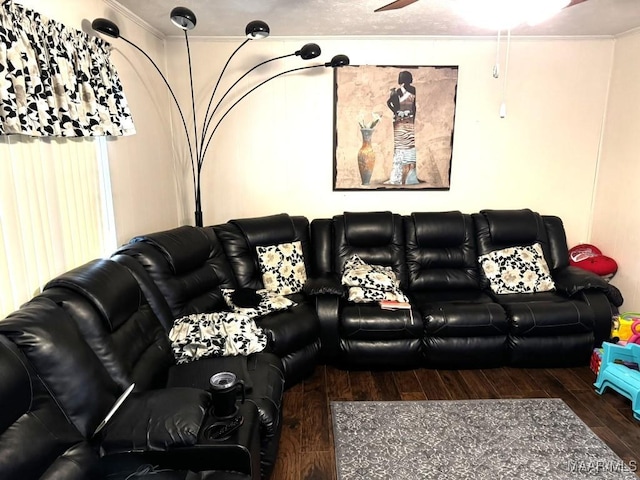 living room featuring crown molding and dark hardwood / wood-style floors