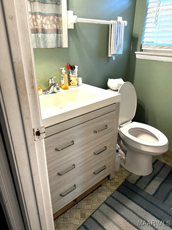 bathroom with vanity and toilet