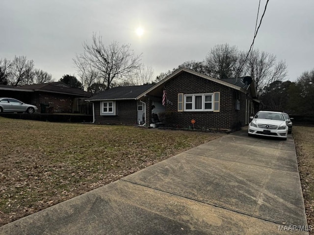 ranch-style house with a front lawn