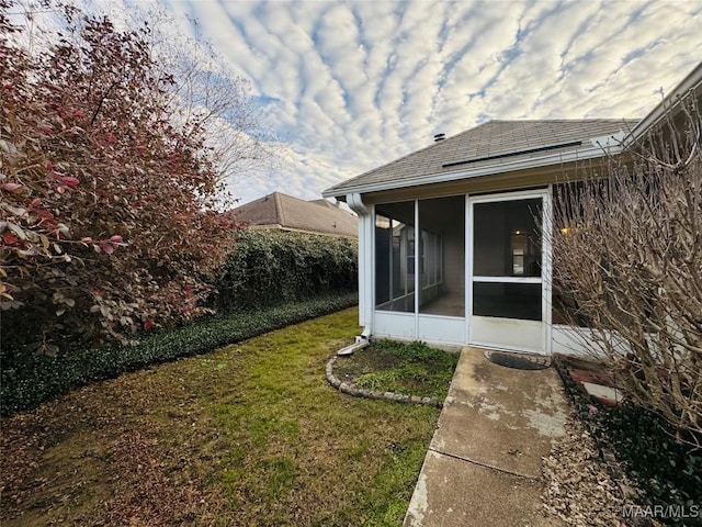 view of yard with a sunroom