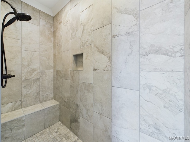 bathroom featuring tiled shower