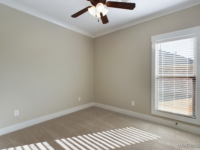 spare room with light carpet, ceiling fan, and ornamental molding