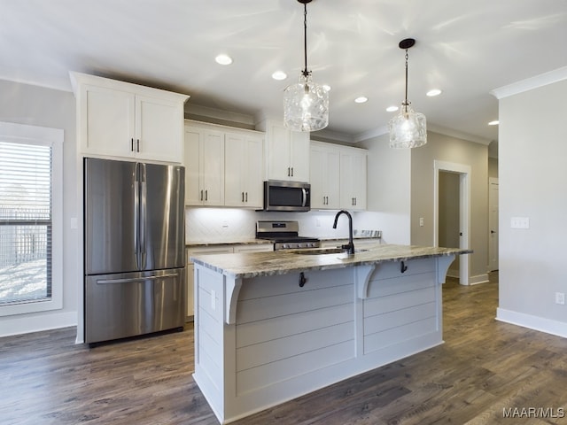 kitchen featuring white cabinets, a kitchen island with sink, and appliances with stainless steel finishes