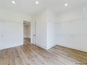 unfurnished room with recessed lighting and wood finished floors