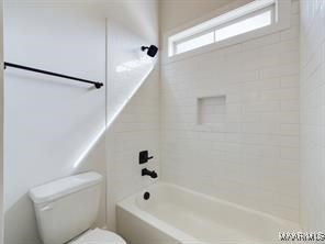 full bath featuring shower / bath combination and toilet