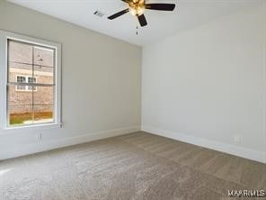 unfurnished room with carpet floors, ceiling fan, and baseboards