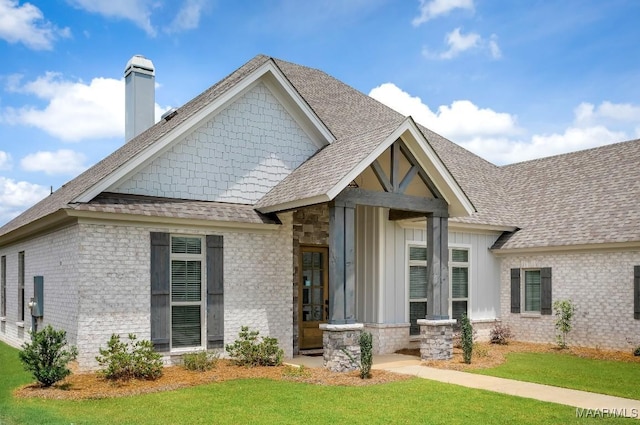 8319 Young Xing, Montgomery, AL 36116 - craftsman-style house with a chimney, a front lawn, and roof with shingles