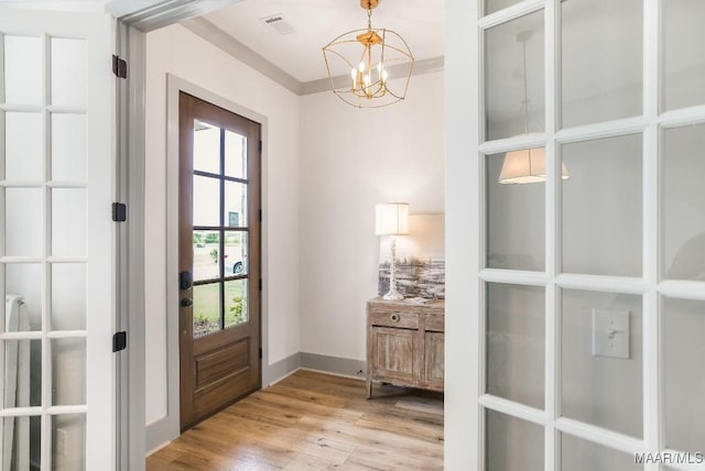 8319 Young Xing, Montgomery, AL 36116 - entryway featuring light wood-type flooring and a chandelier