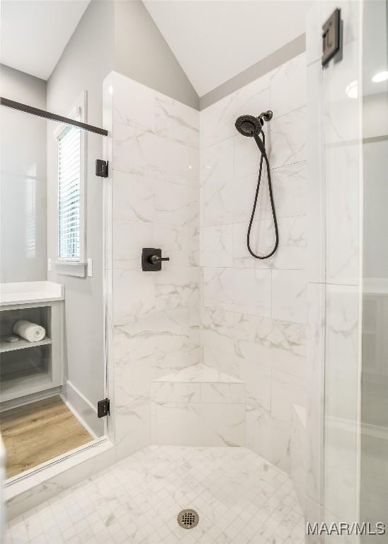 8319 Young Xing, Montgomery, AL 36116 - bathroom with a marble finish shower, vaulted ceiling, and wood finished floors
