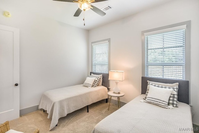 8319 Young Xing, Montgomery, AL 36116 - carpeted bedroom with multiple windows and ceiling fan
