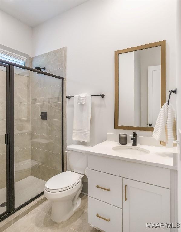 8319 Young Xing, Montgomery, AL 36116 - bathroom featuring vanity, a stall shower, and tile patterned floors