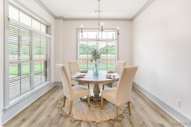 8319 Young Xing, Montgomery, AL 36116 - dining area with a chandelier, plenty of natural light, crown molding, and light wood-style floors