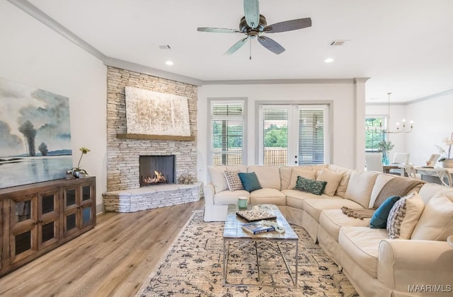 8319 Young Xing, Montgomery, AL 36116 - living room featuring a chandelier, wood finished floors, ceiling fan, ornamental molding, and recessed lighting