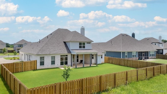 8319 Young Xing, Montgomery, AL 36116 - rear view of property with a patio, a fenced backyard, a shingled roof, and driveway