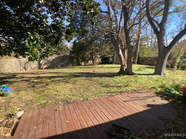 wooden deck with a lawn