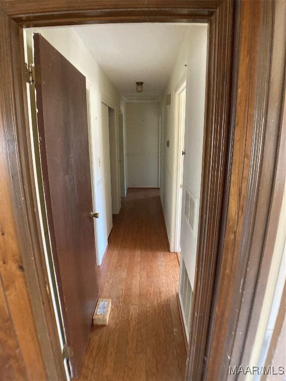 hallway featuring hardwood / wood-style floors