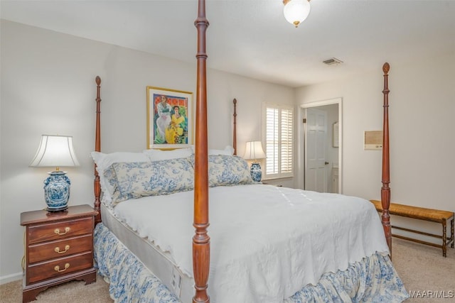 bedroom featuring light carpet