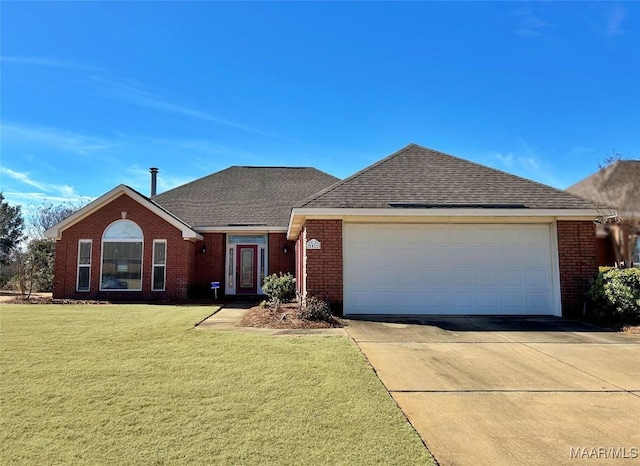 single story home with a garage and a front lawn