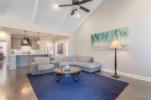 living room with dark hardwood / wood-style flooring, beamed ceiling, high vaulted ceiling, ornamental molding, and ceiling fan