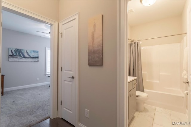 full bathroom featuring toilet, ceiling fan, vanity, and shower / tub combo with curtain