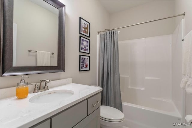 full bathroom featuring toilet, vanity, and shower / bath combo with shower curtain