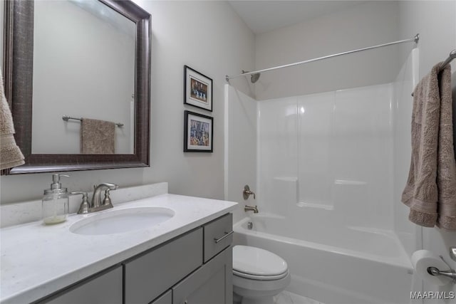 full bathroom with shower / bathing tub combination, vanity, and toilet