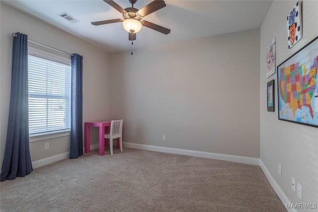 empty room with light carpet and ceiling fan