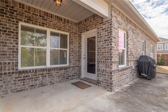 property entrance featuring a patio