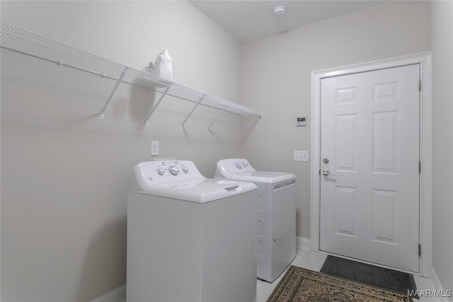 laundry room with independent washer and dryer