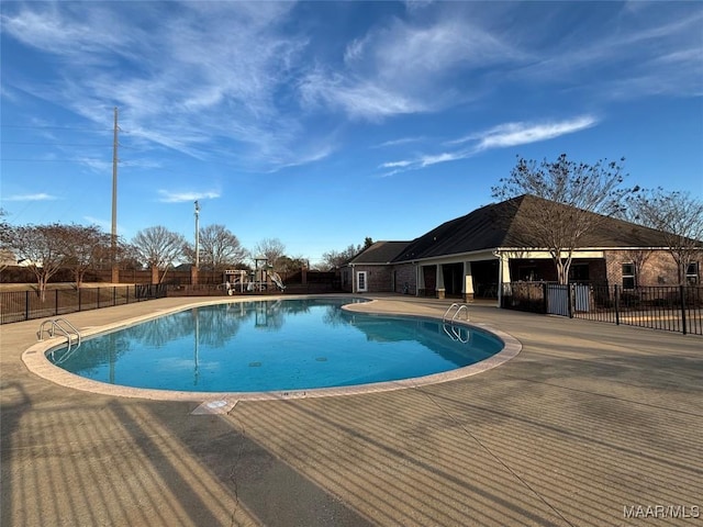 view of swimming pool with a patio area