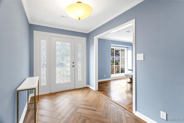 entrance foyer featuring crown molding and parquet floors