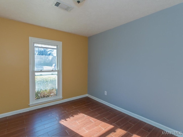 empty room featuring dark hardwood / wood-style floors