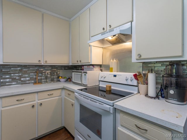 kitchen with crown molding, decorative backsplash, white appliances, and white cabinetry